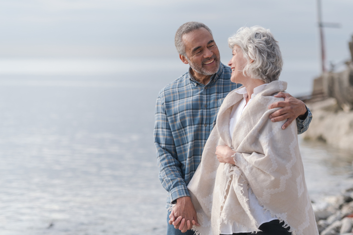 Laughing senior couple on a beach