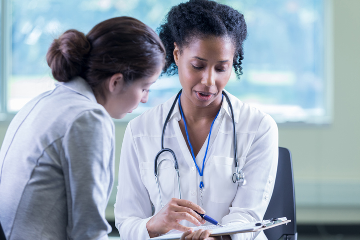 Doctor reviews a patient’s medical information